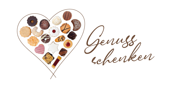 Herz aus Weihnachtsgebäck mit dem Text Genuss schenken
